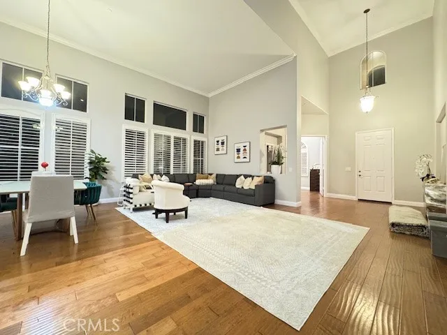 a living room with furniture a fireplace and next to a window