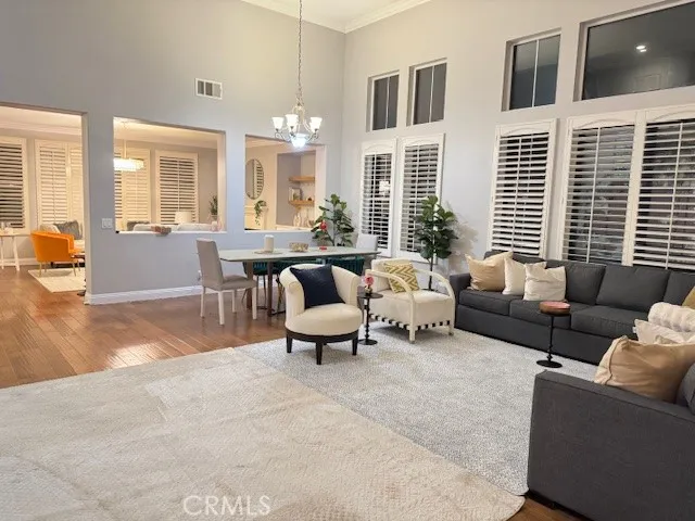 a bedroom with a bed lamp and window