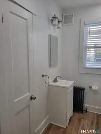 a bathroom with a sink and mirror