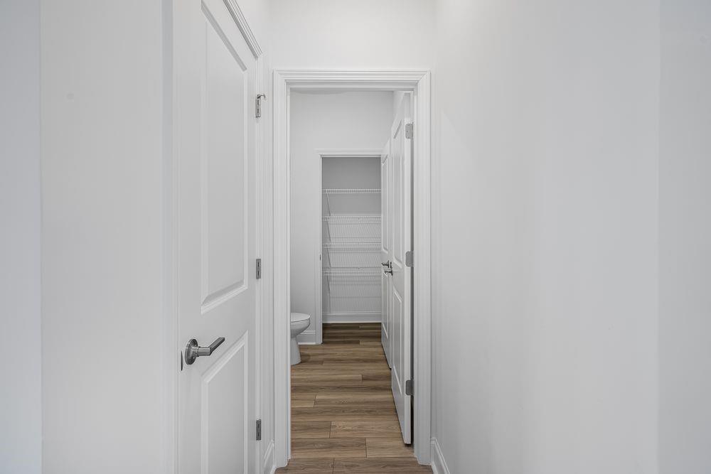 3299 Shirecrest Lane Dacula, GA 30019 - Photo 12 of 38 a view of a hallway with wooden floor and closet