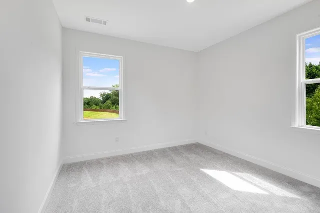 an empty room with a natural light