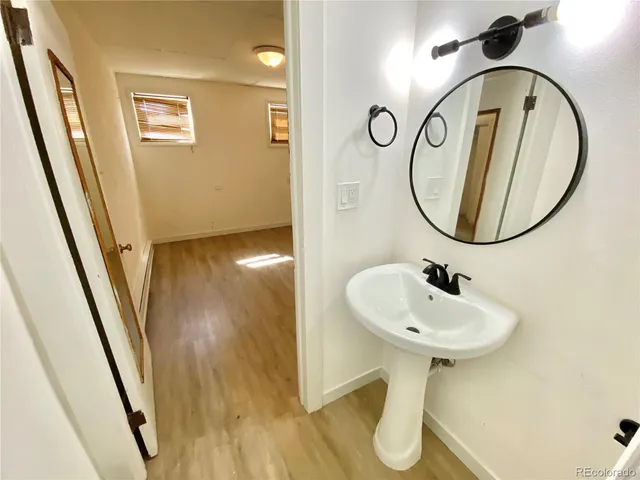 a view of staircase with wooden floor