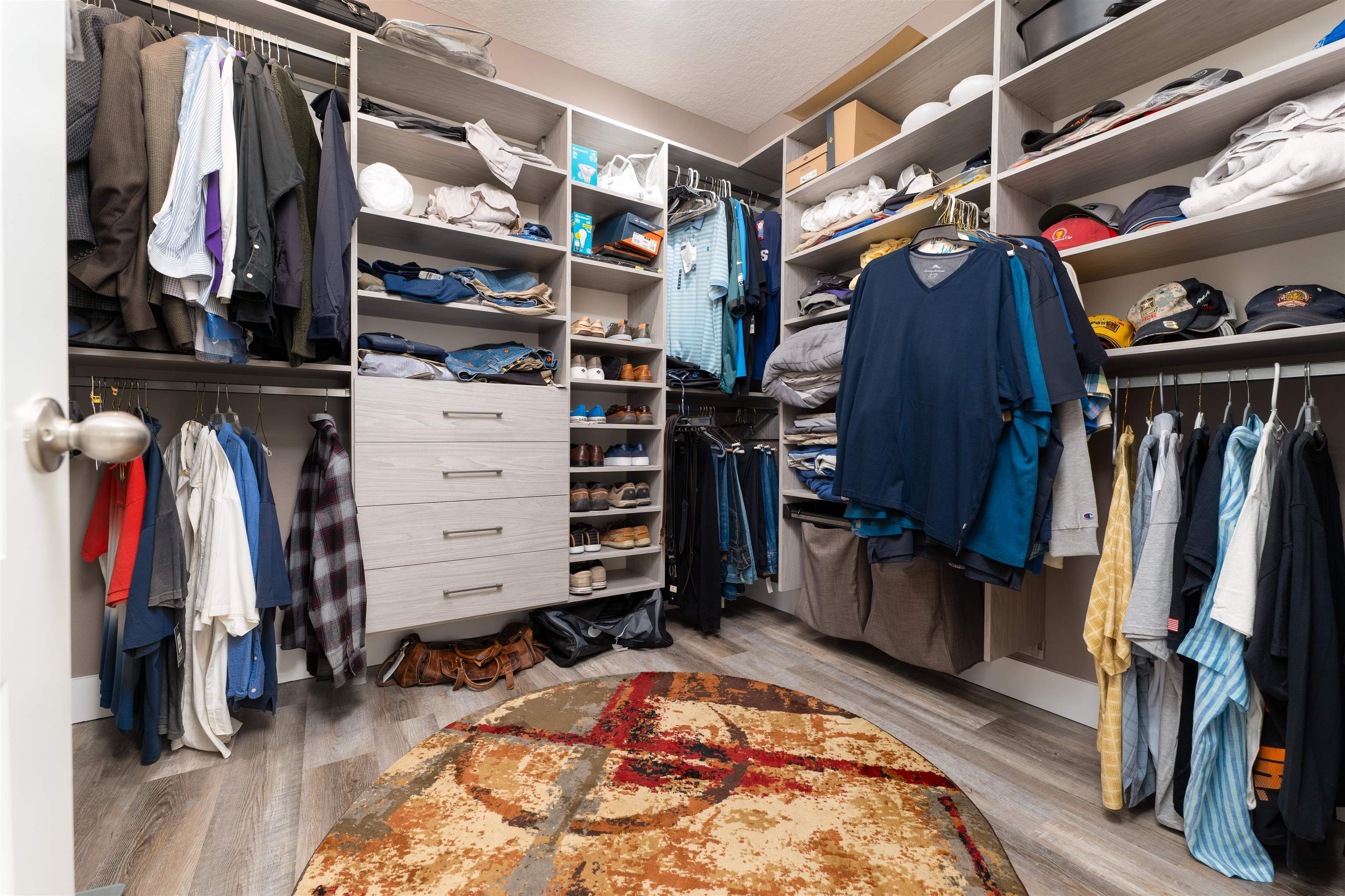 392 Downs Corner Road St. Augustine, FL 32092 - Photo 18 of 55 a view of walk in closet with clothes and shoes