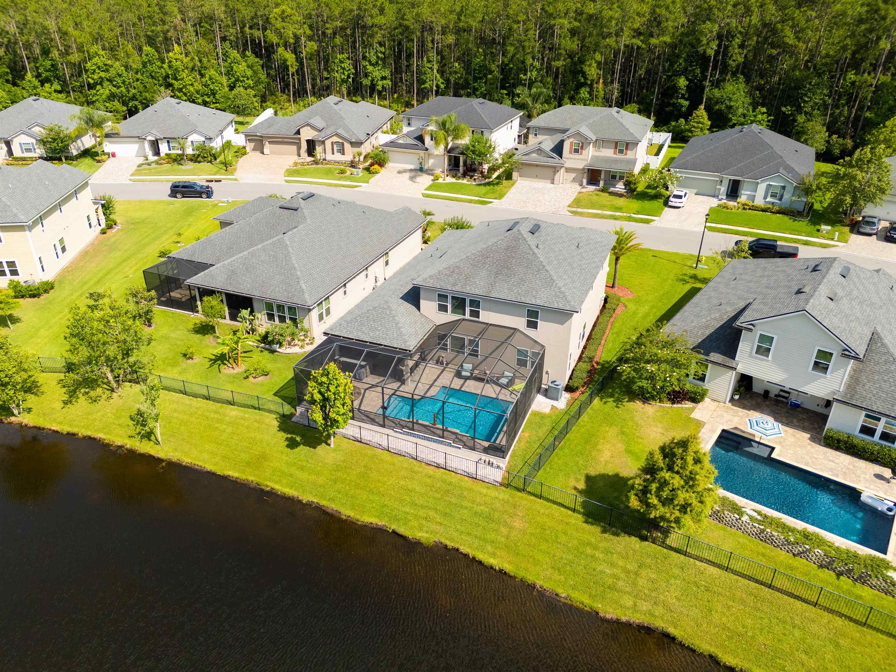 392 Downs Corner Road St. Augustine, FL 32092 - Photo 2 of 55 an aerial view of a swimming pool with outdoor seating