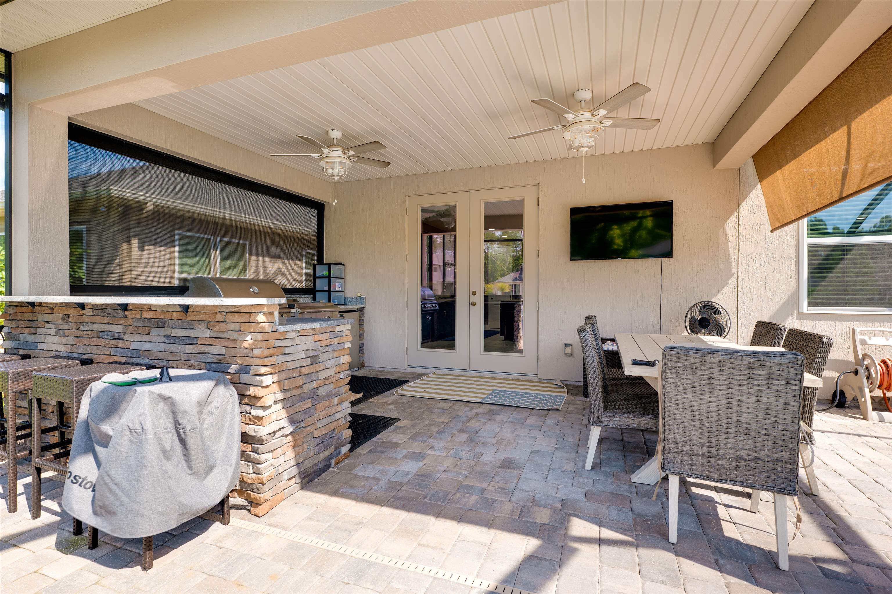392 Downs Corner Road St. Augustine, FL 32092 - Photo 35 of 55 a living room with furniture and a flat screen tv