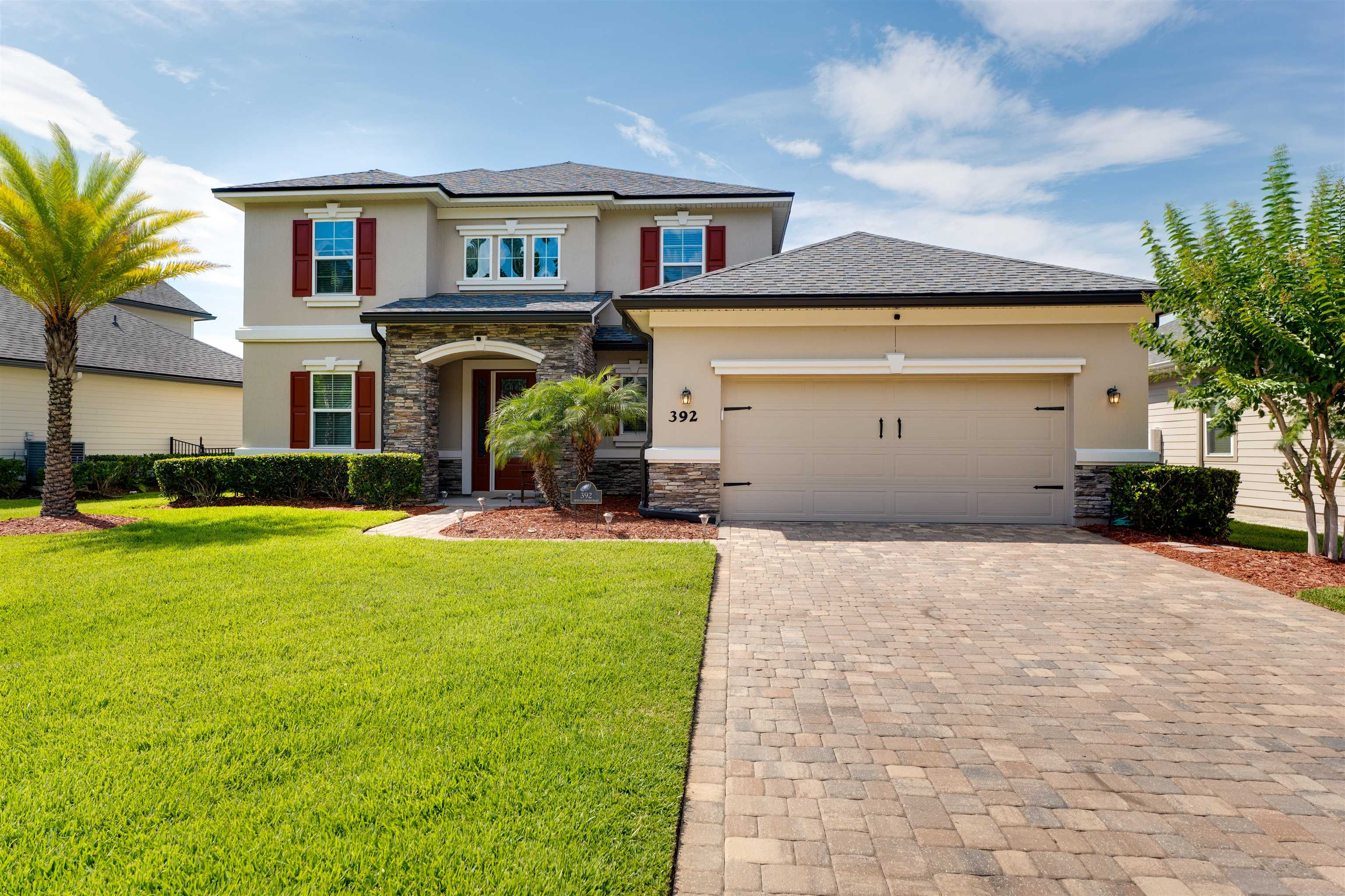 392 Downs Corner Road St. Augustine, FL 32092 - Photo 45 of 55 a front view of house with yard and swimming pool