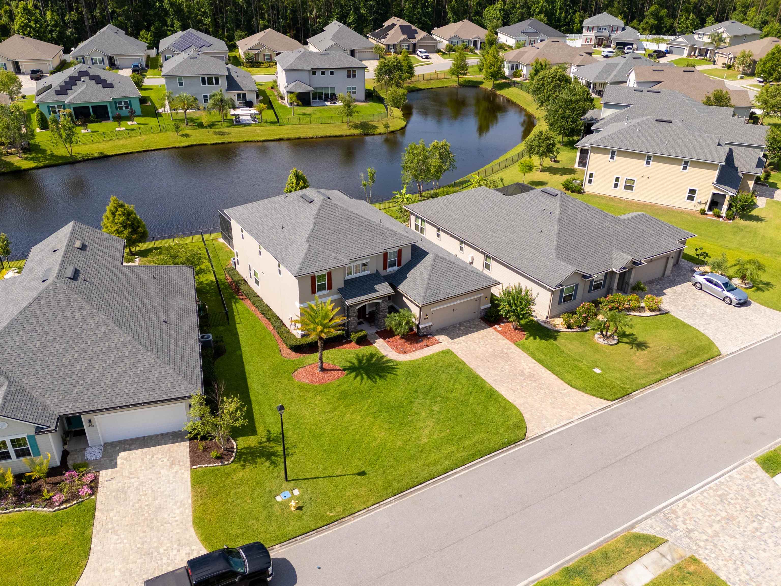 392 Downs Corner Road St. Augustine, FL 32092 - Photo 47 of 55 an aerial view of a house with swimming pool and large trees