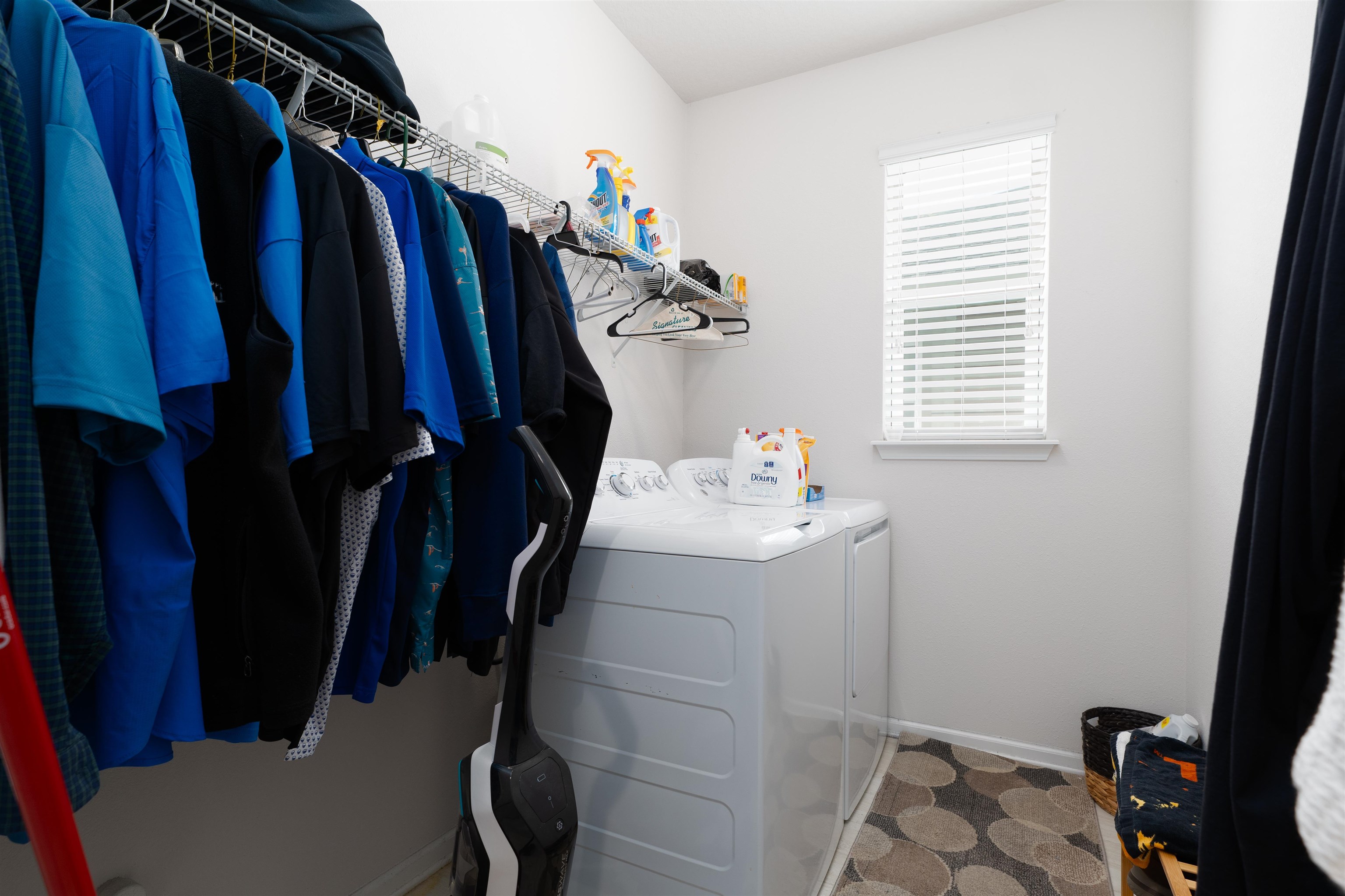 392 Downs Corner Road St. Augustine, FL 32092 - Photo 6 of 55 a view of walk in closet with clothes and shoes