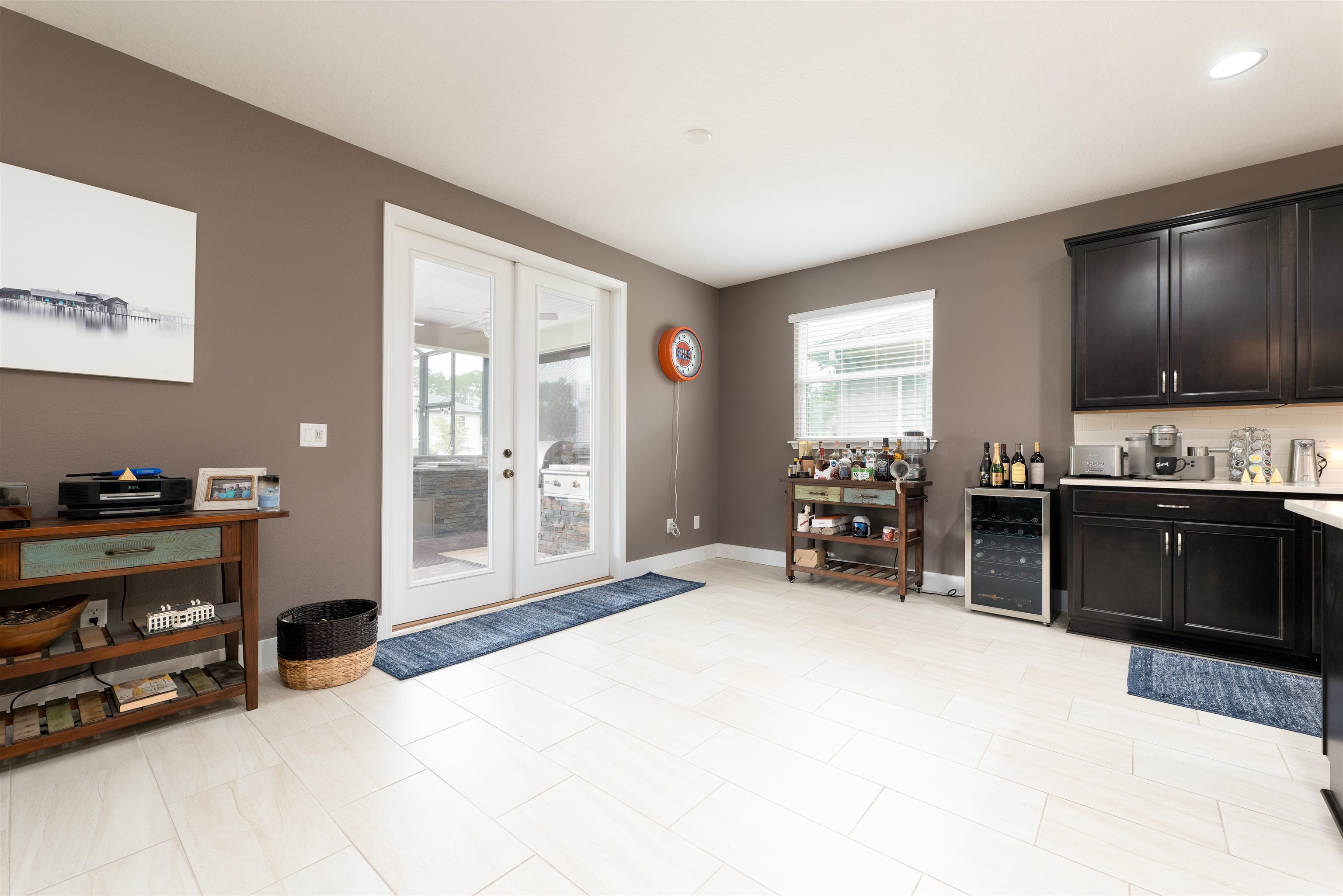 392 Downs Corner Road St. Augustine, FL 32092 - Photo 10 of 55 a large bedroom with furniture and flat screen tv