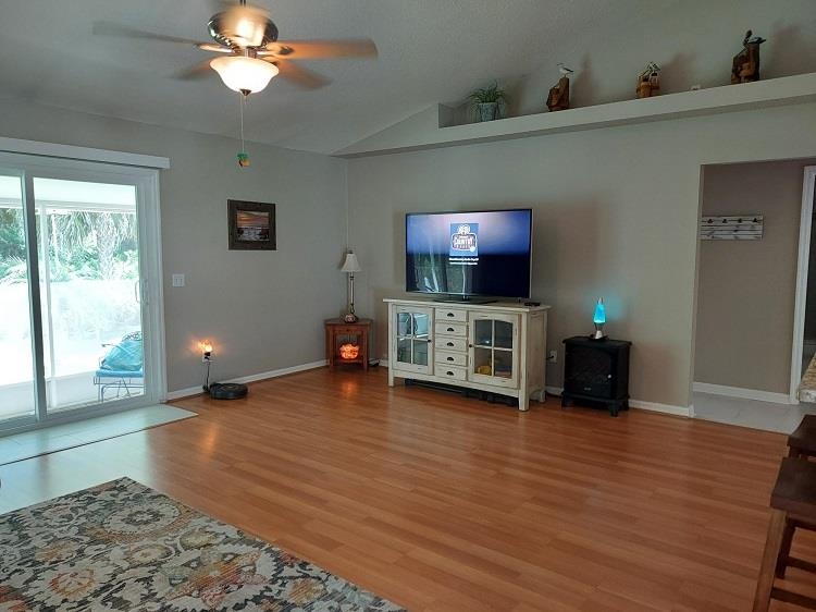 127 Cowry Road St. Augustine, FL 32086 - Photo 4 of 24 a view of livingroom with furniture wooden floor and window