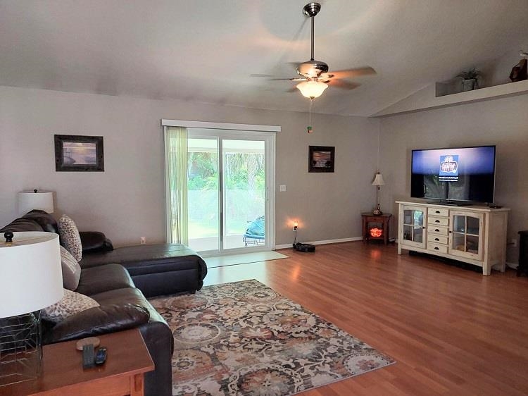 127 Cowry Road St. Augustine, FL 32086 - Photo 5 of 24 a living room with furniture and a flat screen tv