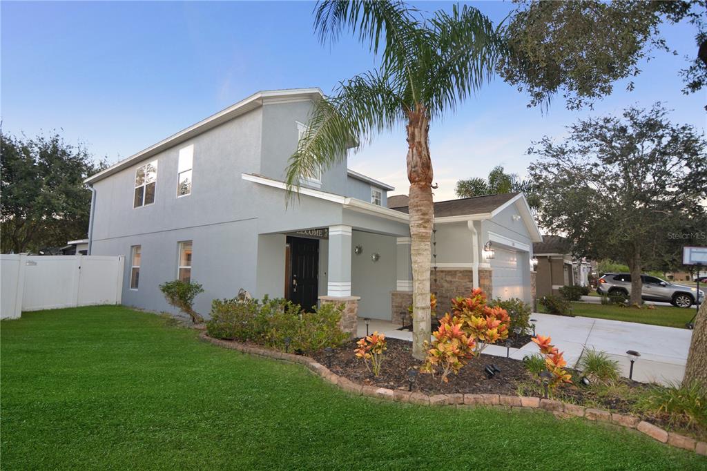 a front view of a house with garden