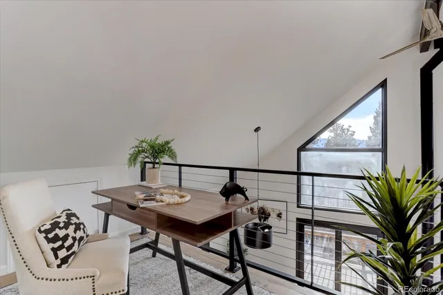 a view of room with window and wooden floor