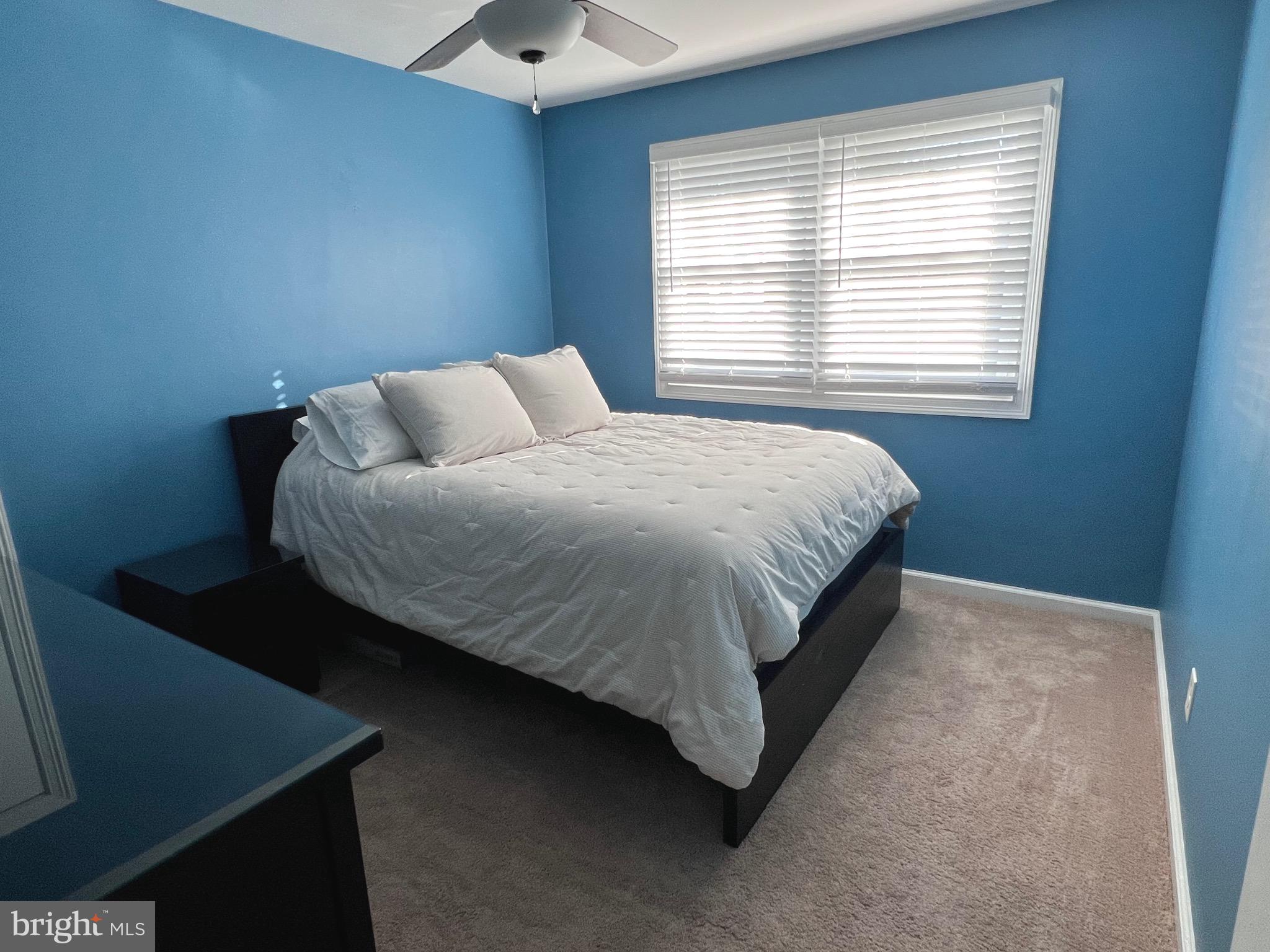 216 Fenimore Lane Delanco, NJ 08075 - Photo 18 of 25 a bed sitting in a bedroom next to a window