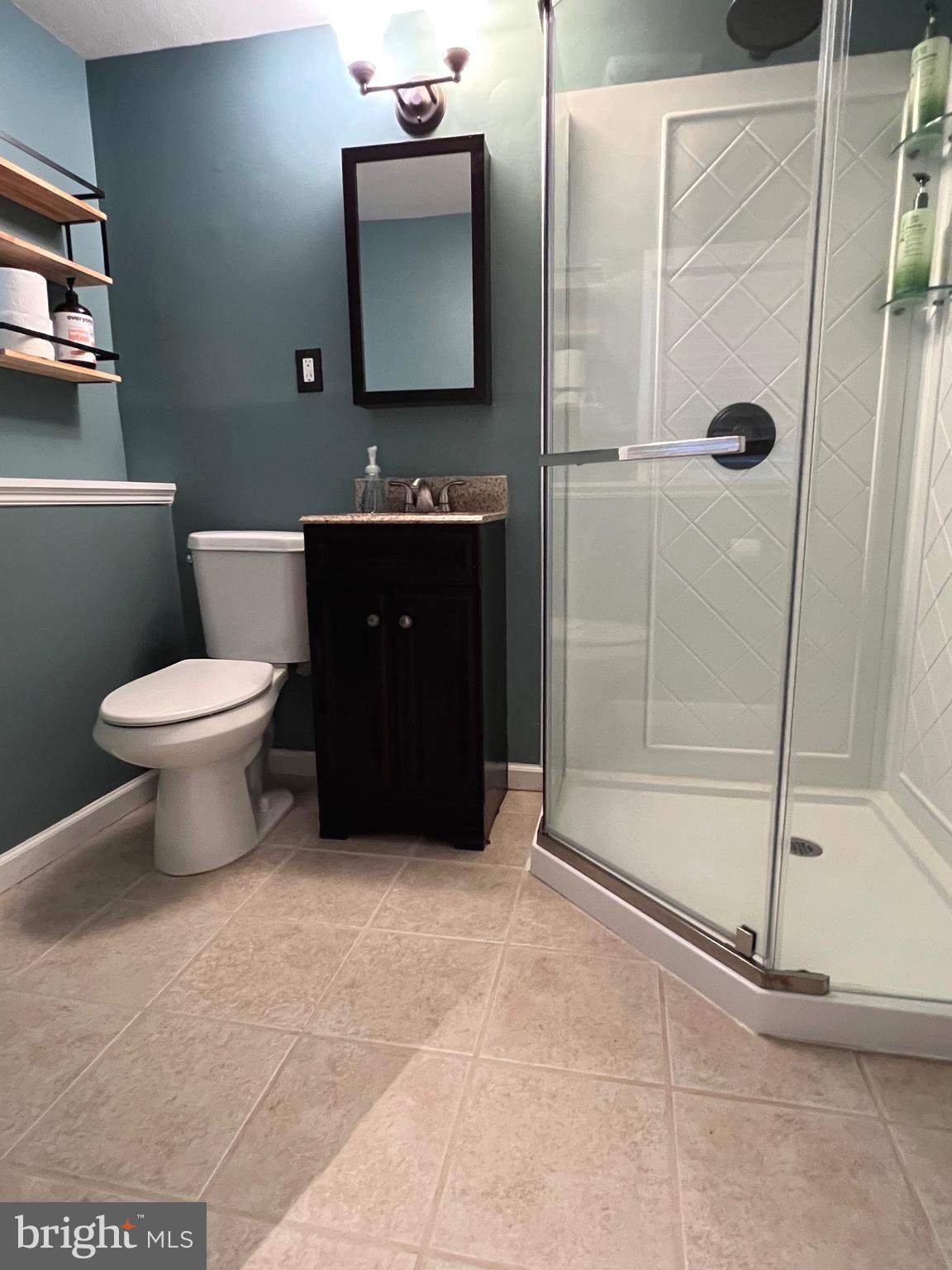 216 Fenimore Lane Delanco, NJ 08075 - Photo 21 of 25 a bathroom with a toilet sink and shower