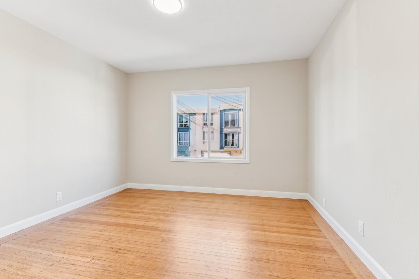 136 Chester Street Daly City, CA 94014 - Photo 21 of 48 a view of empty room with wooden floor and fan