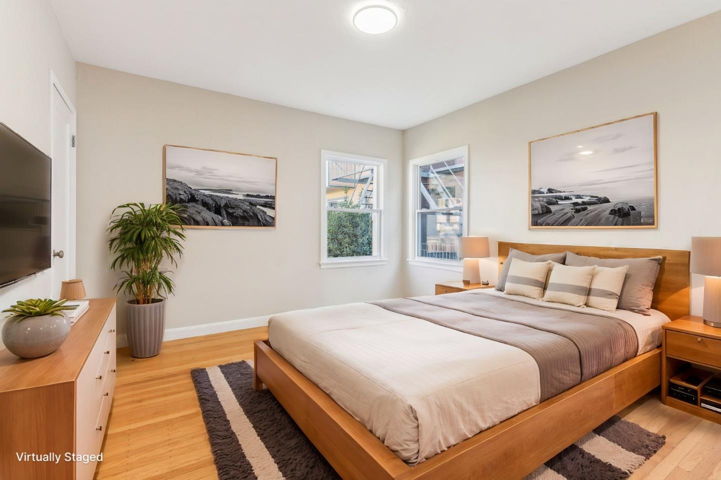 136 Chester Street Daly City, CA 94014 - Photo 23 of 48 a bedroom with a bed and a flat screen tv