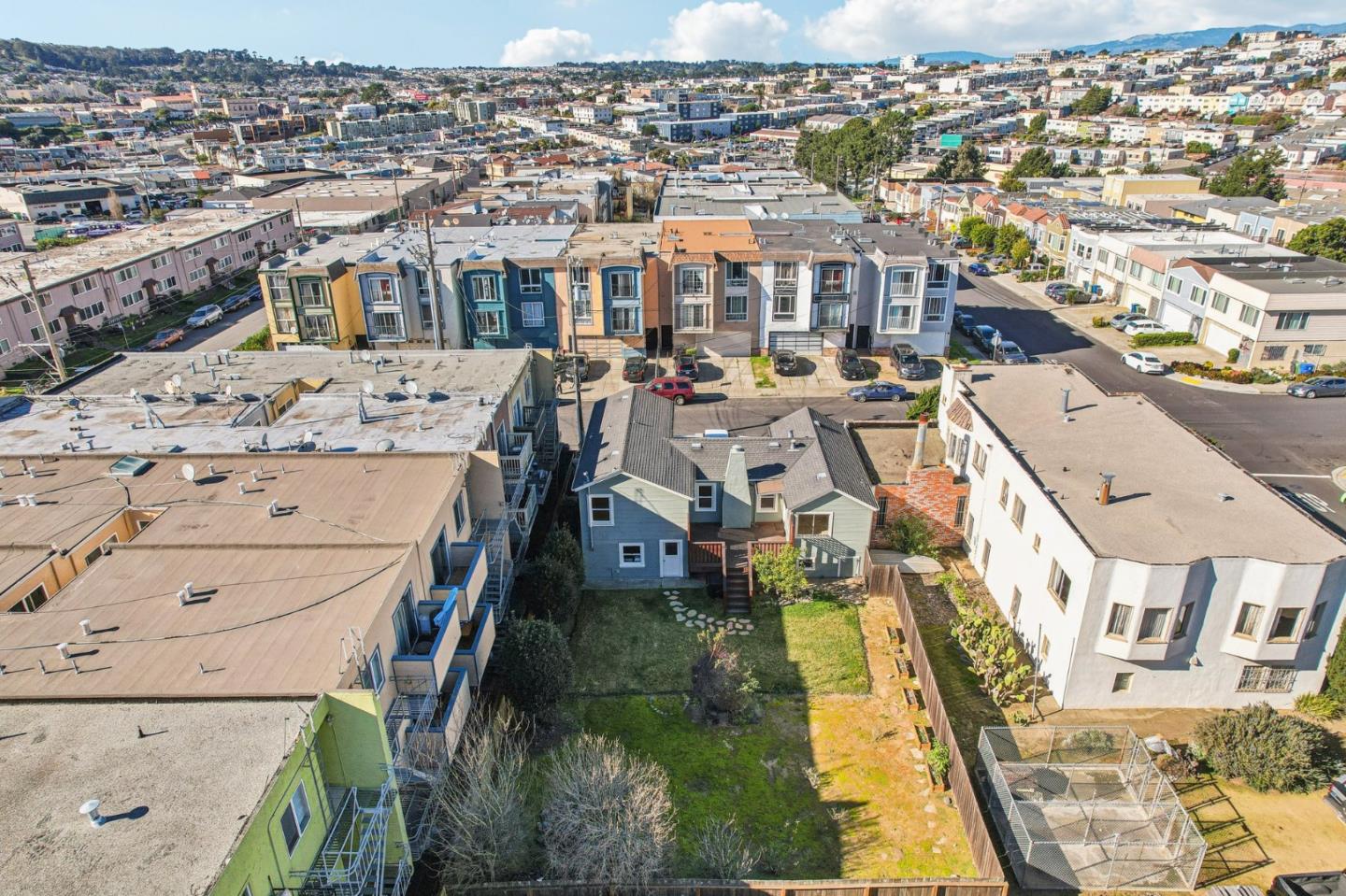136 Chester Street Daly City, CA 94014 - Photo 43 of 48 an aerial view of residential houses with yard