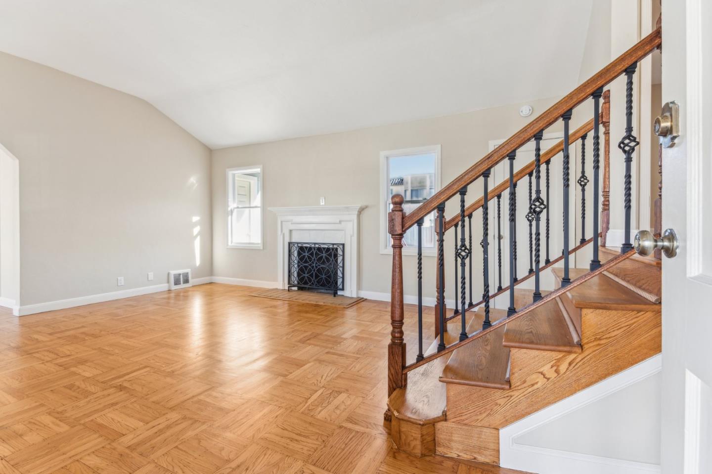 136 Chester Street Daly City, CA 94014 - Photo 7 of 48 a view of an empty room with wooden floor and fireplace