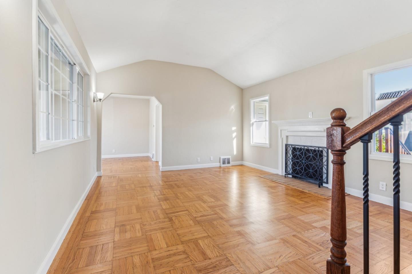 136 Chester Street Daly City, CA 94014 - Photo 8 of 48 a view of an empty room with window and stairs