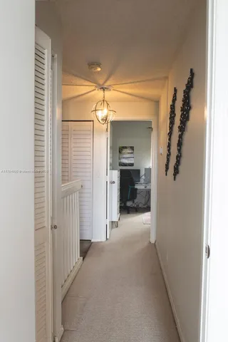 a view of a hallway view with furniture