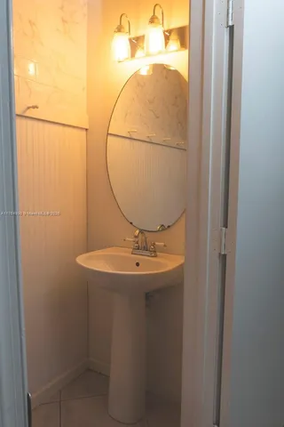 a bathroom with a sink and mirror