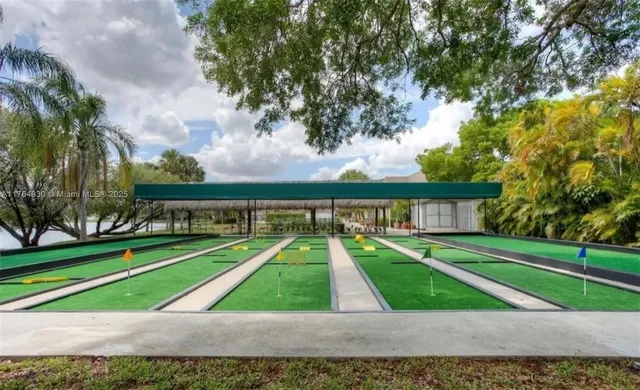a view of backyard with swimming pool