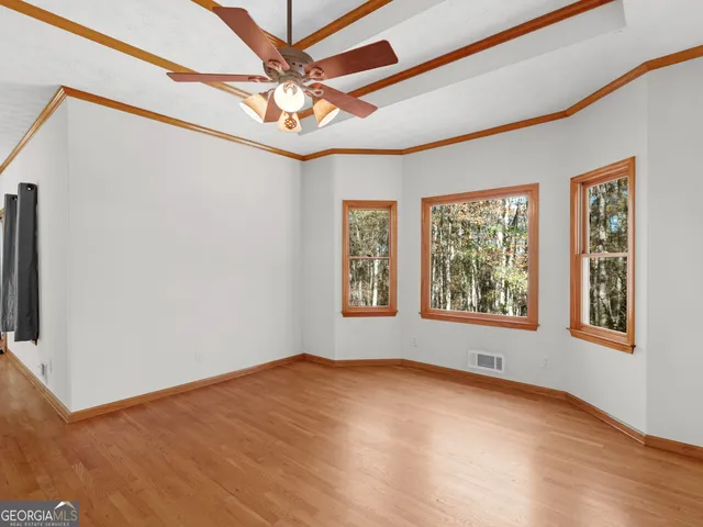 a view of an empty room with a window