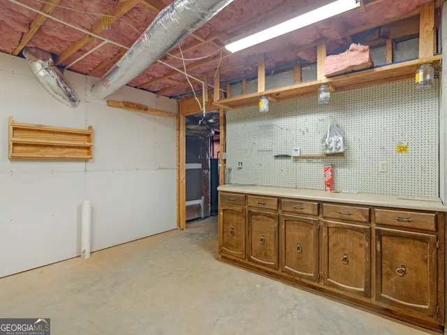 a utility room with cabinets