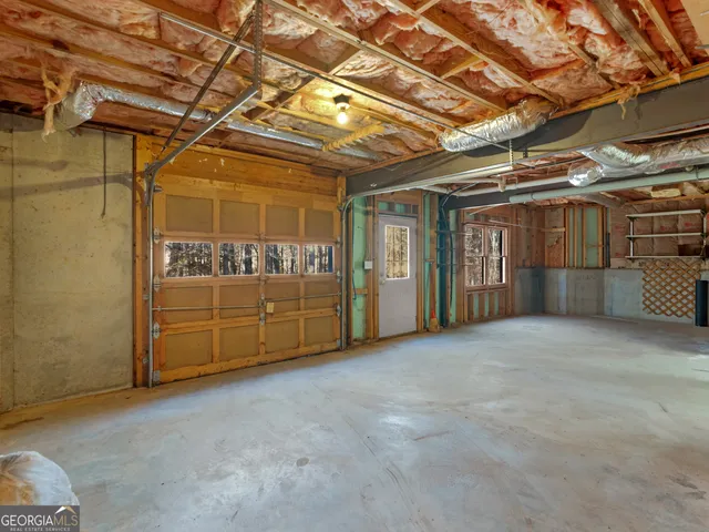 a view of a room with wooden walls