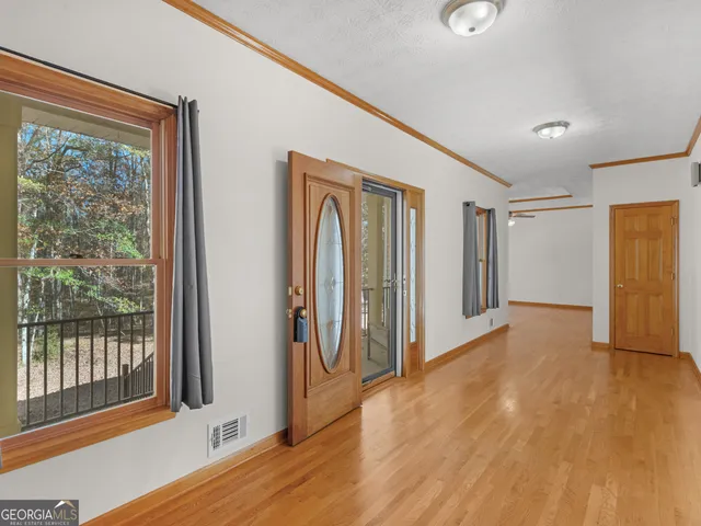 a view of entryway with wooden floor