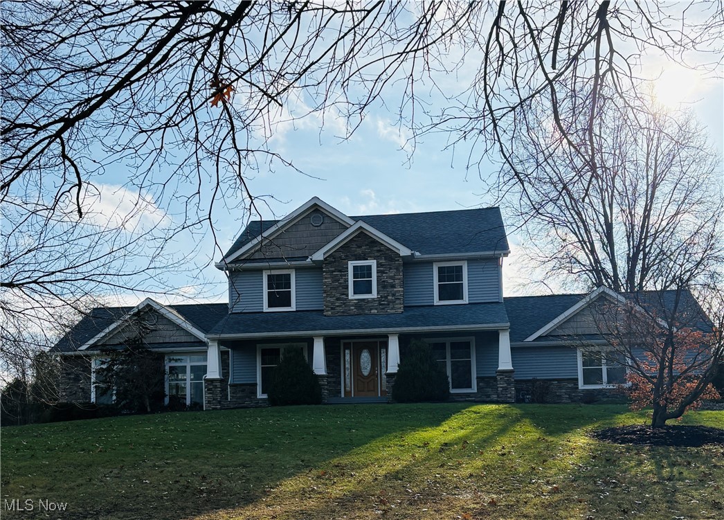 View of front of house with a front lawn