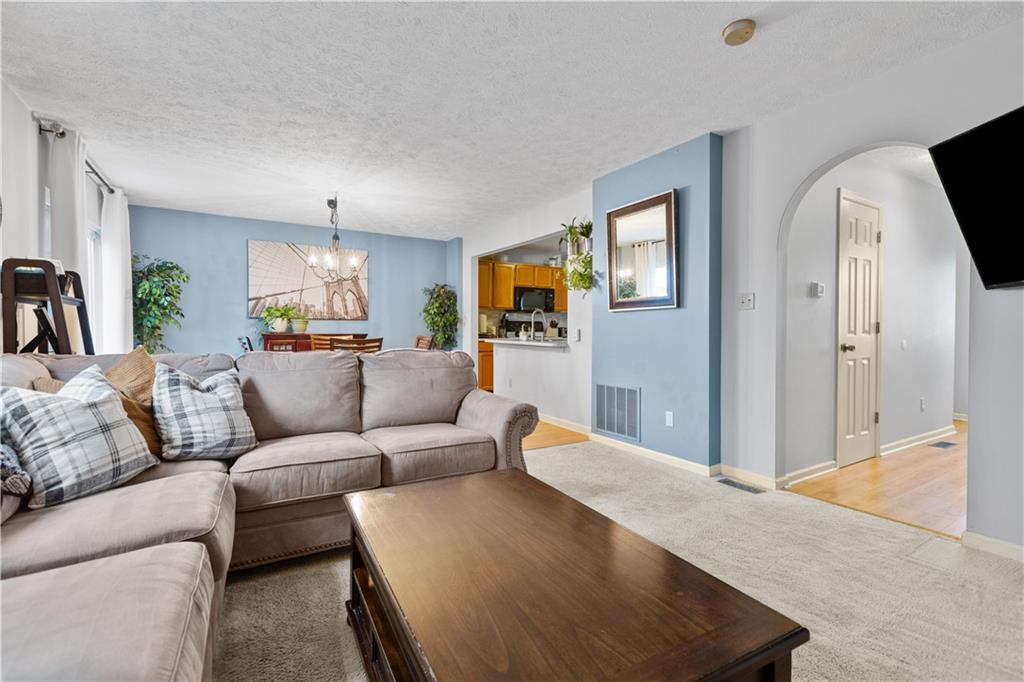 2018 Arbor Ridge Court Cheswick, PA 15024 - Photo 4 of 25 a living room with furniture and a flat screen tv