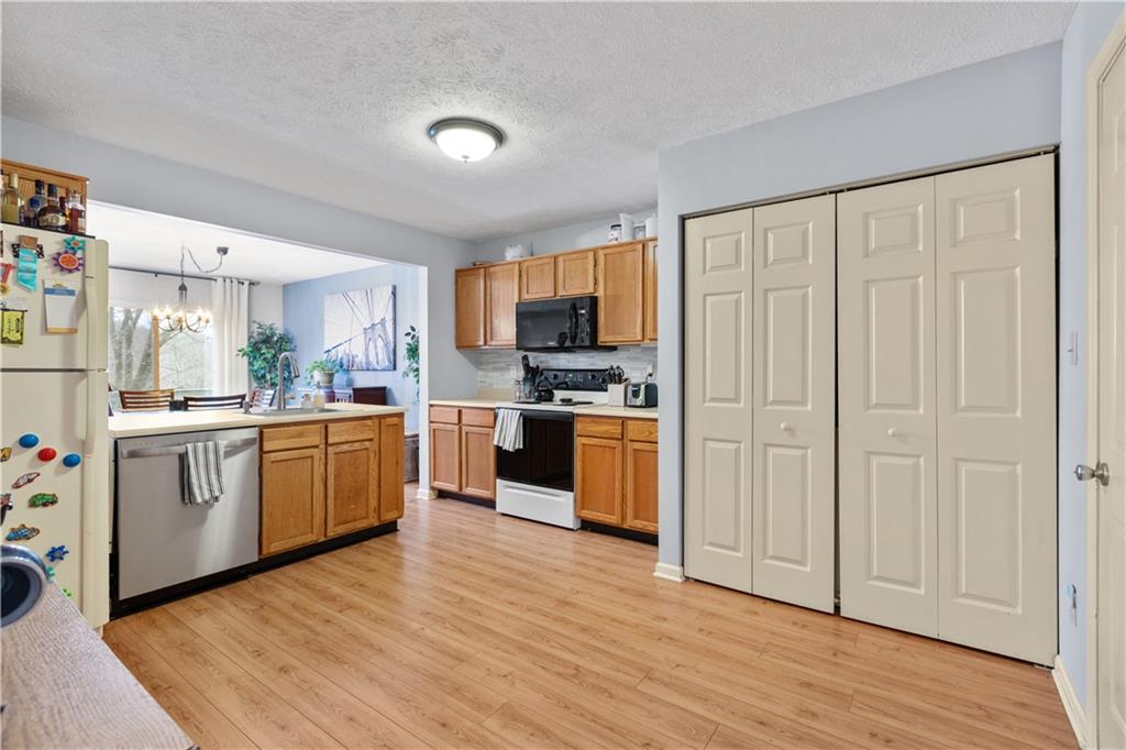 2018 Arbor Ridge Court Cheswick, PA 15024 - Photo 8 of 25 a kitchen with a refrigerator and white cabinets