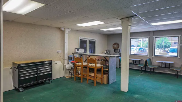 a room with furniture and a play ground