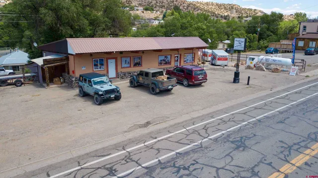 a living room with lots of furniture and a flat screen tv