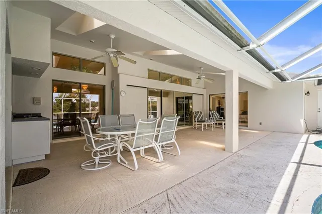 a dining area with furniture a table and chairs