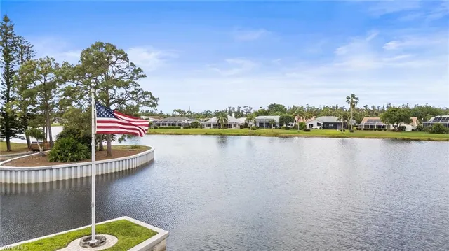 a view of a lake with a house in the background