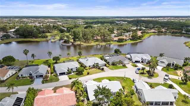 an aerial view of a house with a lake view