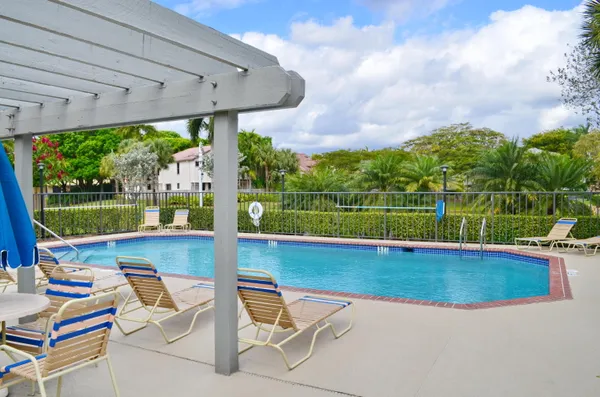 a view of a swimming pool with a patio