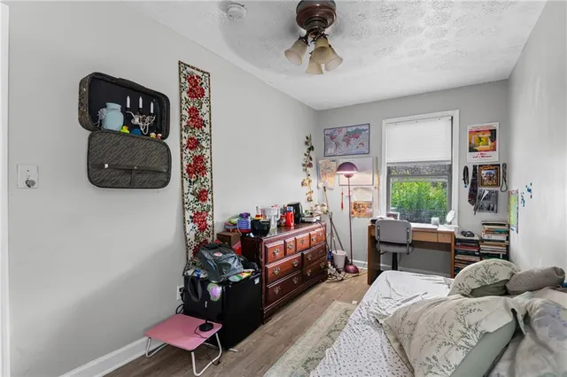 a bedroom with furniture and a window