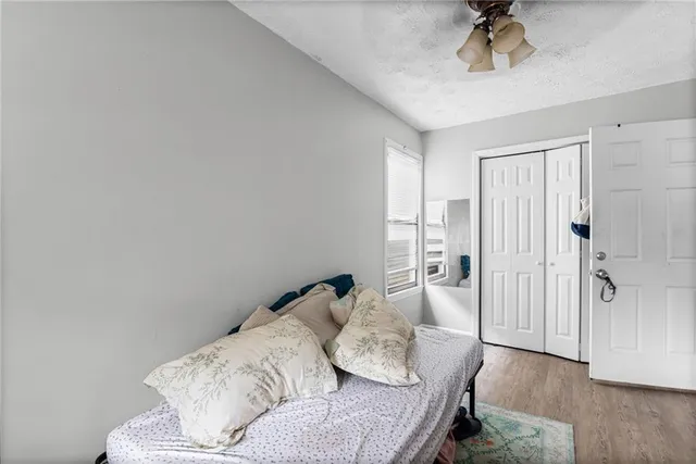 a living room with furniture and a ceiling fan
