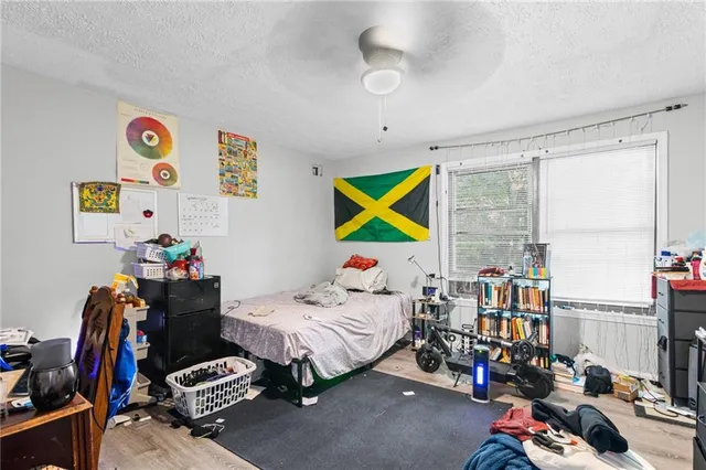 a bedroom with bed and a window