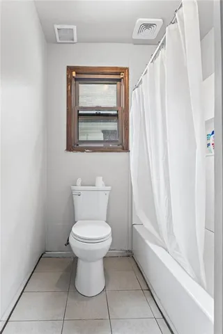 a bathroom with a toilet and a sink
