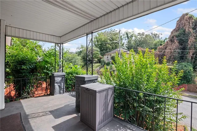 a backyard of a house with lake view and a potted plant