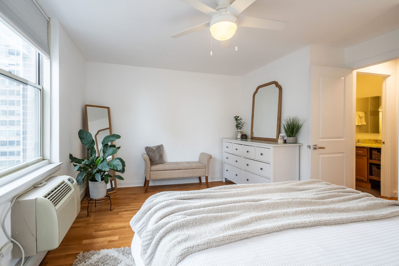 3033 North Sheridan Road, Unit 1203 Chicago, IL 60657 - Photo 13 of 22 a bedroom with a bed and a chandelier