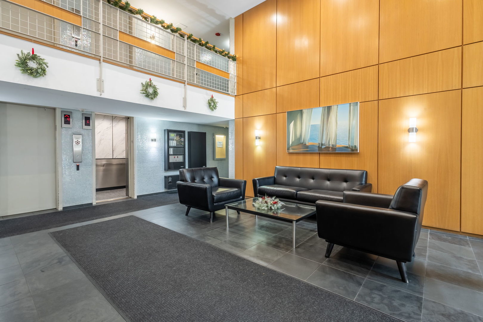 3033 North Sheridan Road, Unit 1203 Chicago, IL 60657 - Photo 20 of 22 a living room with furniture a lamp and a table