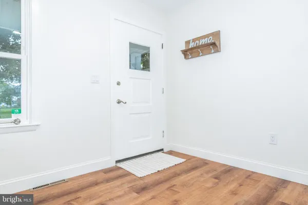 a view of a small space with wooden floor