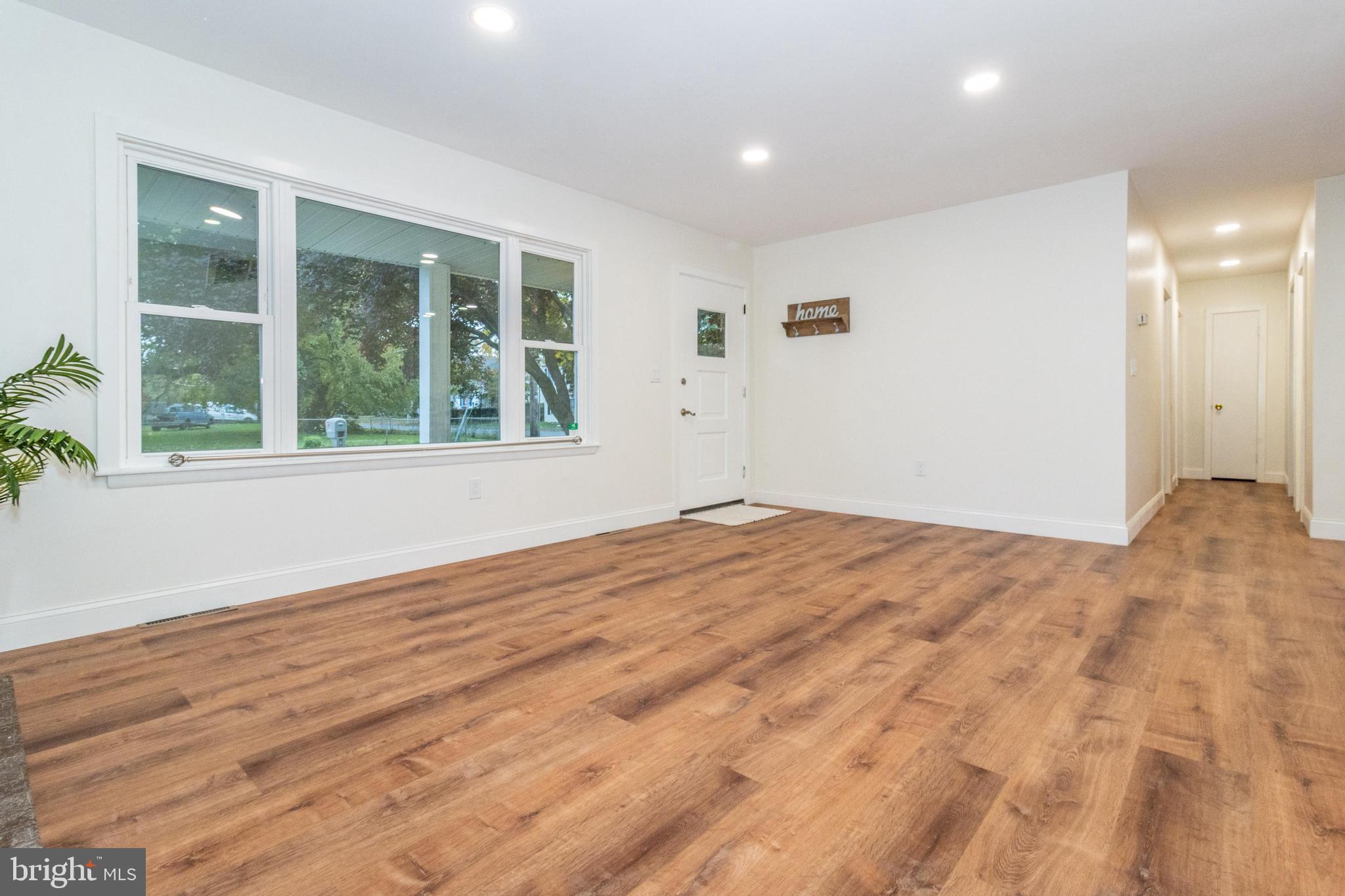 320 Kenmore Avenue Edgewater, MD 21037 - Photo 13 of 43 a view of empty room with wooden floor and fan