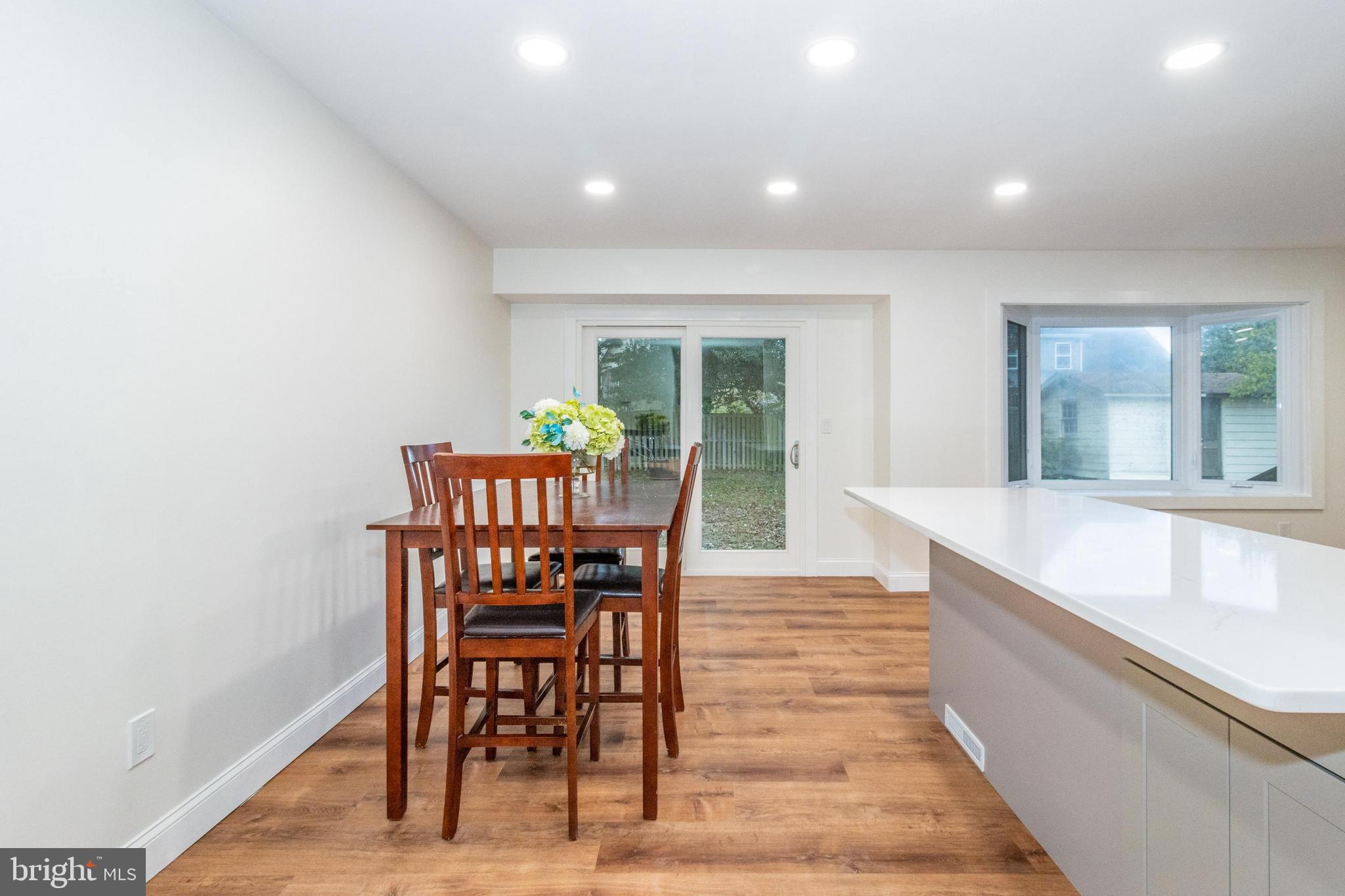 320 Kenmore Avenue Edgewater, MD 21037 - Photo 15 of 43 a view of a dining room with furniture and wooden floor